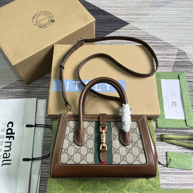 G*u*i top handle bags